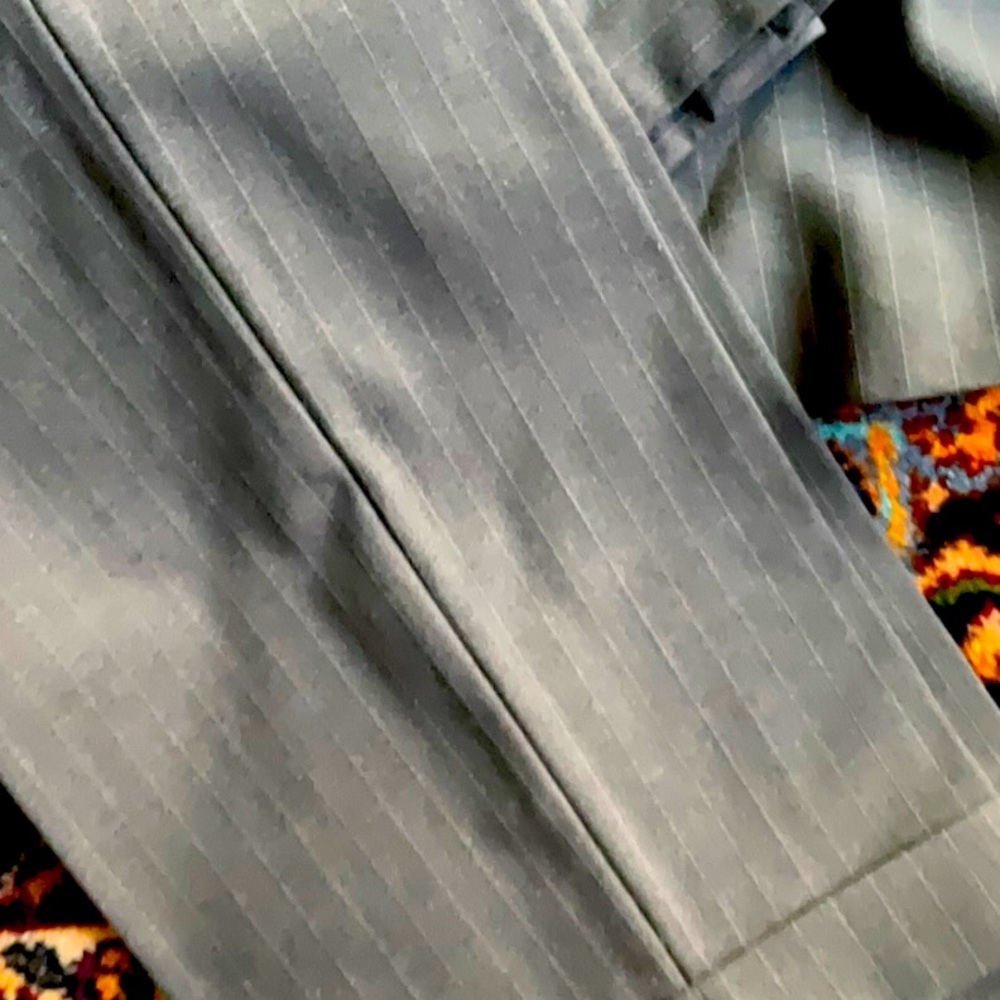 Grey pinstripe suit. Jacket is a 42 long and pants are a size 36.
